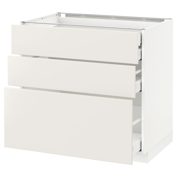 A white METOD kitchen cabinet with three drawers, smooth and modern design.