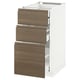 A white kitchen cabinet with three dark walnut drawers. The cabinet has a minimalist design, featuring handleless wooden drawer fronts.