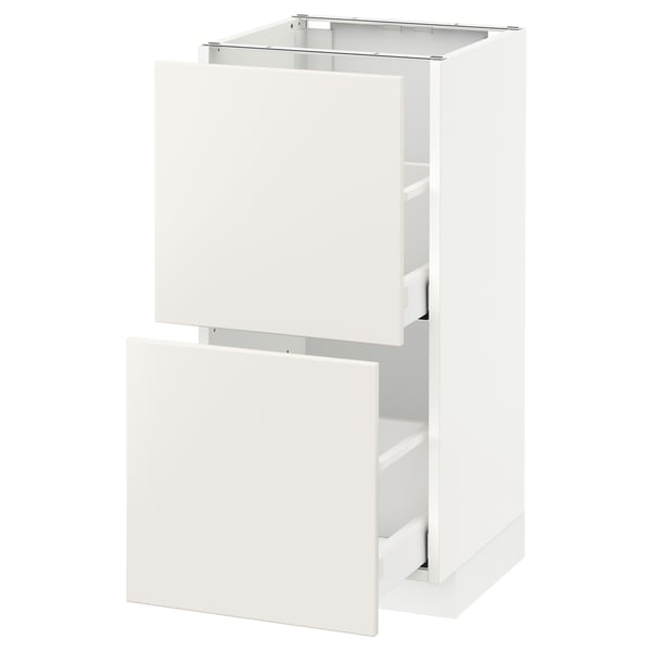 White kitchen cabinet, modern design with smooth drawers, part of IKEAs METOD system.