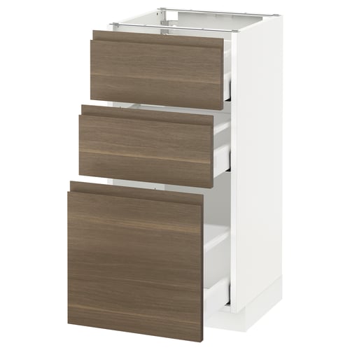 A white METOD kitchen cabinet with three dark walnut effect drawers.