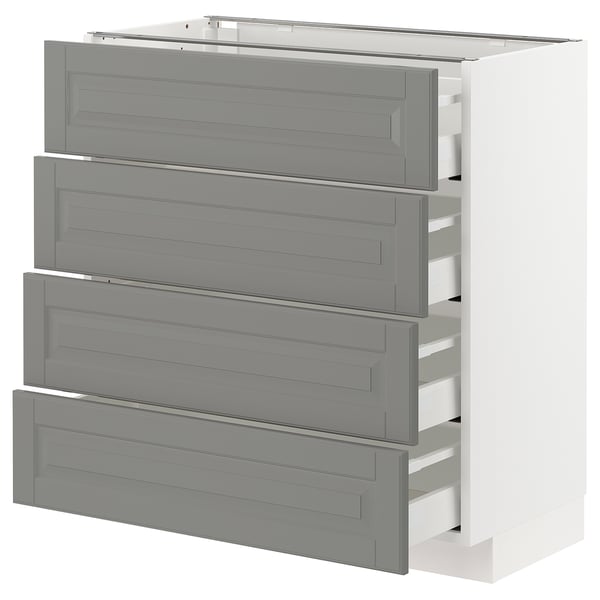 White METOD kitchen cabinet with four grey drawers and bevelled edges.
