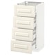 A white METOD kitchen cabinet with off-white drawers featuring bevelled edges.