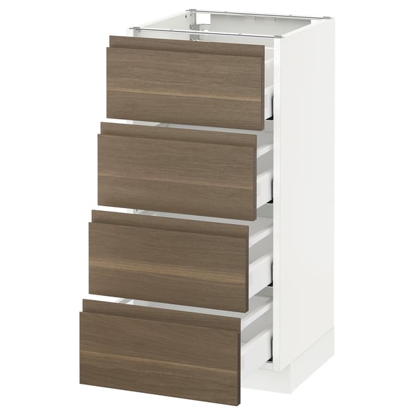 A white METOD kitchen cabinet with four dark walnut drawers. It has a sleek, minimalist design with integrated handles.