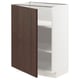 A white METOD kitchen cabinet with a dark brown door featuring oak veneer and solid wood edging. The design is sleek with adjustable shelves.
