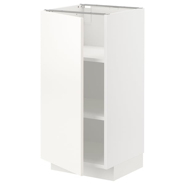 A white METOD kitchen cabinet, sleek and modern, with adjustable shelves and a clean, minimalist design.