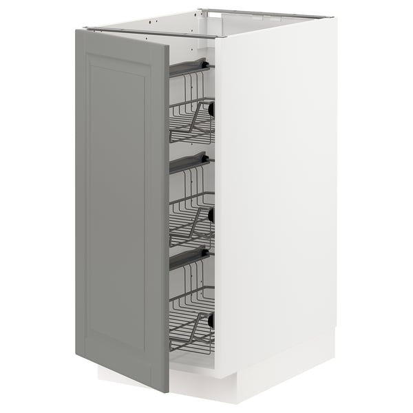 A grey METOD kitchen cabinet with pull-out wire baskets for storage.