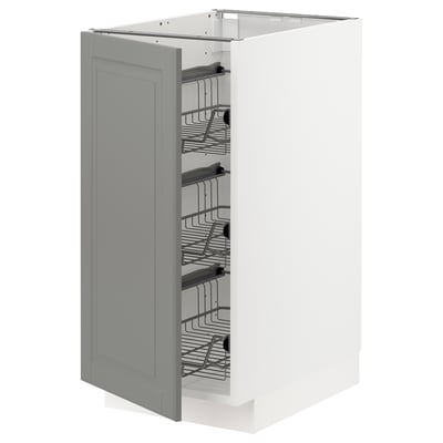 A grey METOD kitchen cabinet with pull-out wire baskets for storage.