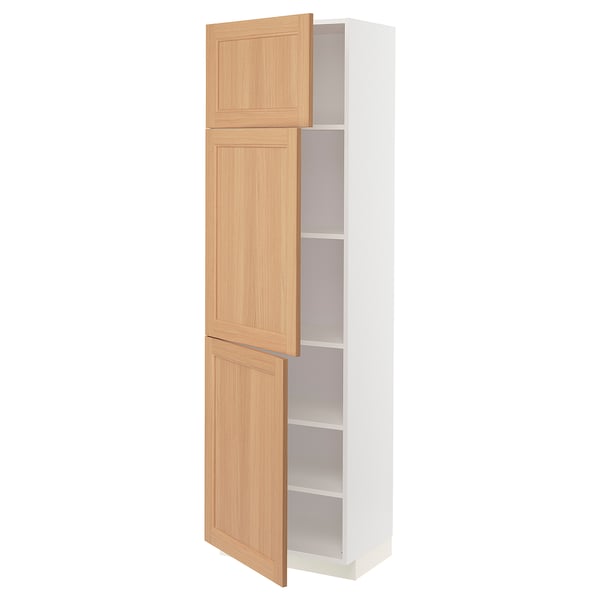 An ikea METOD kitchen cabinet with two oak doors and adjustable shelves.