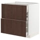 A dark brown METOD kitchen cabinet with oak veneer and solid wood edges, featuring multiple drawers.