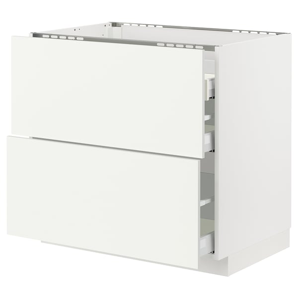 White METOD kitchen cabinet with two drawers and shelves.