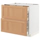 Light wooden ikea METOD kitchen unit with drawers open.