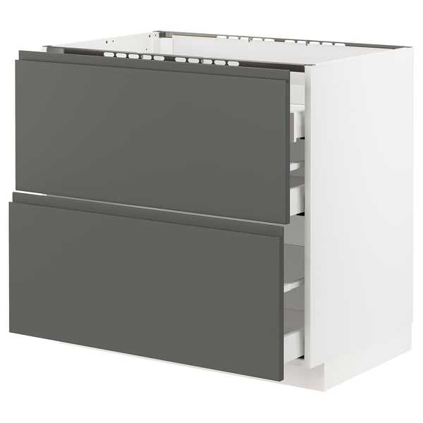 Modern grey ikea METOD kitchen cabinet with sleek, handle-less dark grey drawers and a white base.