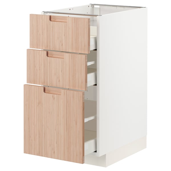 Modern kitchen cabinet with three soft-close drawers, made of natural bamboo and white frame.