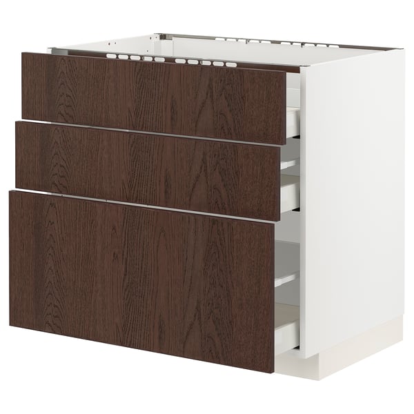 Dark brown wooden drawers on a white cabinet base, part of the METOD kitchen system.