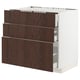 Dark brown wooden drawers on a white cabinet base, part of the METOD kitchen system.