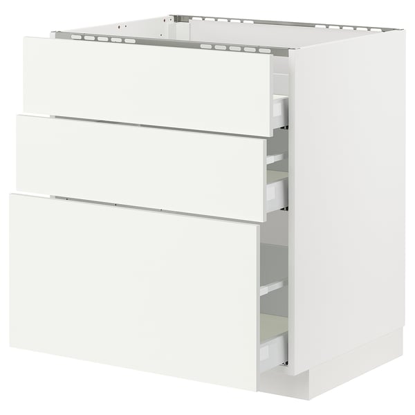 This image shows a white, three-drawer kitchen cabinet from the ikea METOD system. The cabinet has a modern, minimalist design with sleek handles.