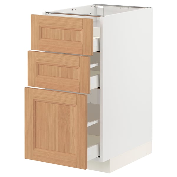 Modern white kitchen cabinet with wood drawers.