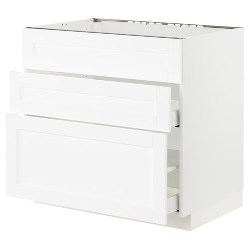 A white METOD kitchen cabinet with a glossy finish and two open drawers.