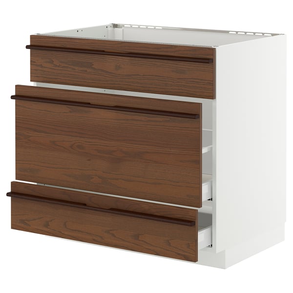 A white and dark brown kitchen cabinet with wooden handles and multiple drawers.
