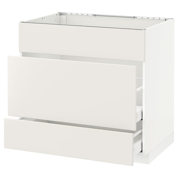 White METOD kitchen cabinet with veddinge smooth fronts, sleek handles, and sturdy construction.