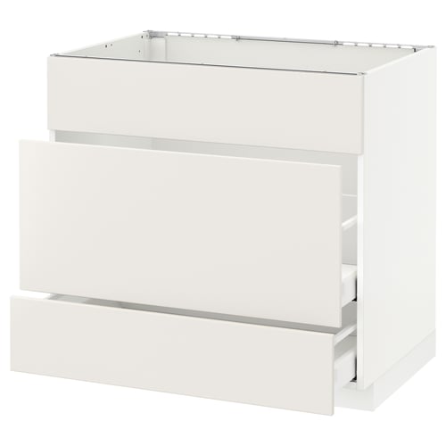 White METOD kitchen cabinet with veddinge smooth fronts, sleek handles, and sturdy construction.
