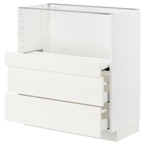 White ikea METOD kitchen cabinet with drawers and pull-out shelf.