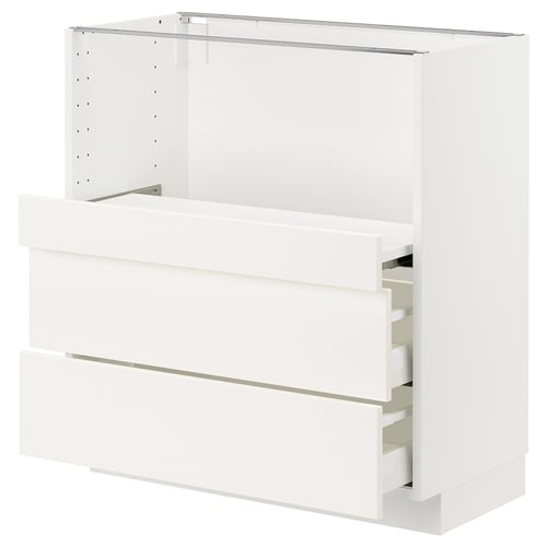 White ikea METOD kitchen cabinet with drawers and pull-out shelf.