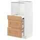 Modern white kitchen unit with oak drawer fronts. Multiple drawers and shelves. Part of IKEAs METOD system.