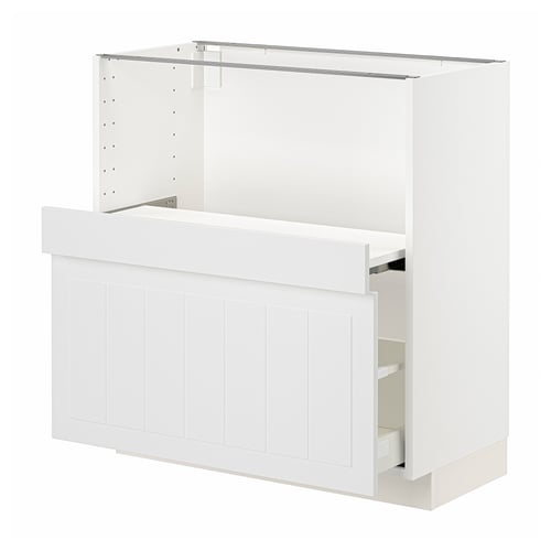 A white METOD kitchen cabinet with a wooden front, featuring a drawer and pull-out shelf.