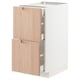 White METOD kitchen cabinet with light bamboo doors in a modern design.