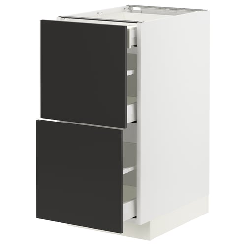 Modern white & black METOD kitchen cabinet with sleek, black drawers and glass shelves.