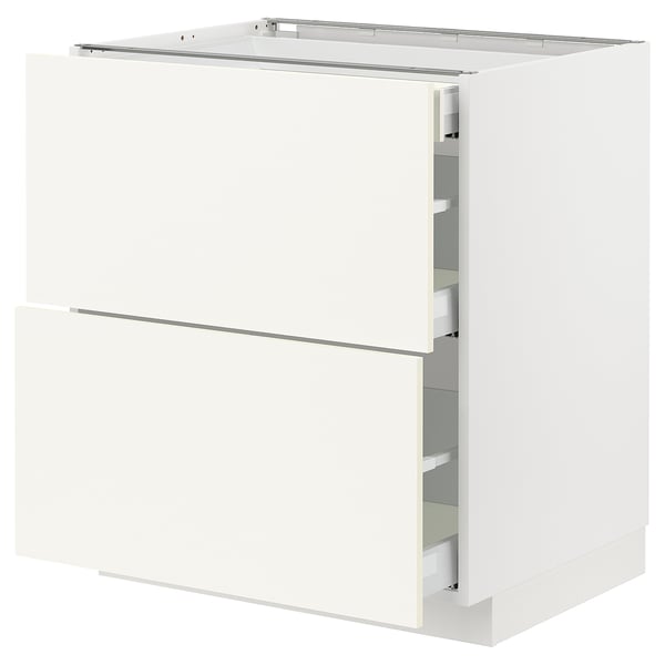 White METOD kitchen cabinet with two drawers and shelves.