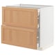 Modern kitchen cabinet with oak and white finish, featuring two pull-out drawers and a flat panel design.