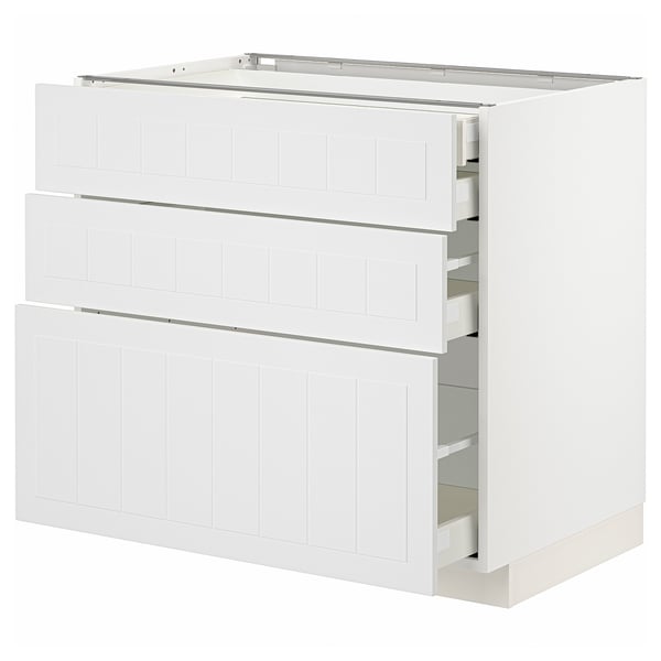 White METOD kitchen cabinet set with three drawers. Modern, crafted look, made from particleboard & steel.