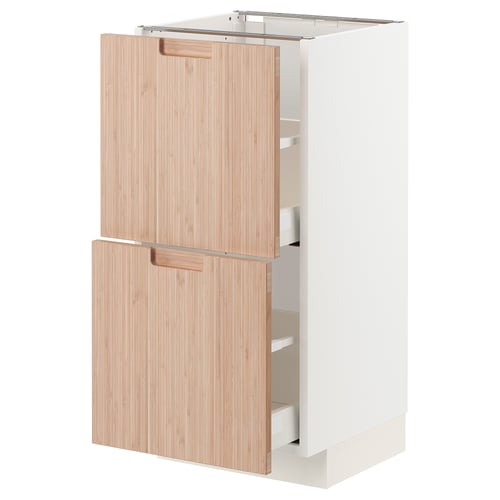 Modern kitchen cabinet: METOD with light bamboo drawers, sleek white frame, rectangular shape, clean design.