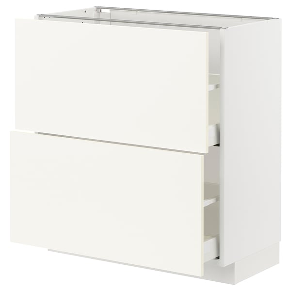 White METOD kitchen cabinet with vallstena fronts, two drawers, rectangular shape.