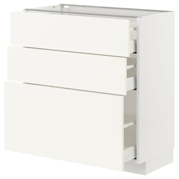 Modern white METOD kitchen unit with three drawers, sleek design, sturdy material.
