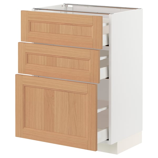 Modern white and wood kitchen cabinet with three open drawers, showing drawers interiors.