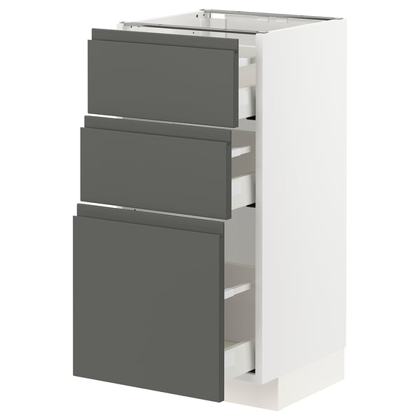 A white and dark grey METOD kitchen cabinet with three drawers and a door. The drawers are modern with integrated handles and a soft-close mechanism.