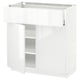 White high-gloss kitchen cabinet with adjustable shelves and smooth-closing drawers, sleek modern design.