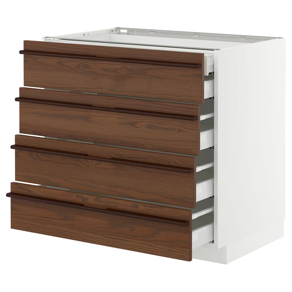 Modern kitchen unit with dark brown wood drawers, white frame, sleek handles, and multiple drawers.