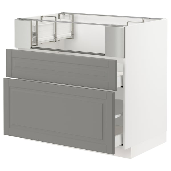 A grey METOD kitchen cabinet with multiple drawers and shelves, featuring a traditional design with bevelled edges.