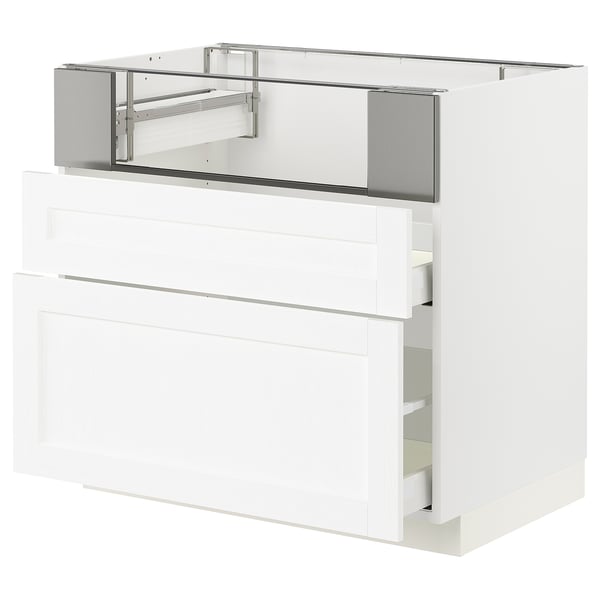 A white METOD kitchen cabinet with multiple drawers. It has a modern, sleek design with a glossy finish. The cabinet is mounted on a metal frame.
