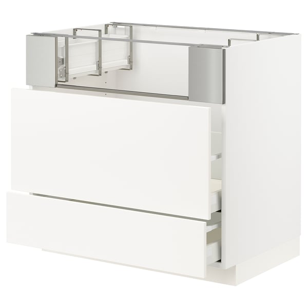 Modern white kitchen cabinet with smooth, clean lines, featuring multiple drawers and metal handles.