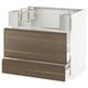 An empty kitchen cabinet frame with walnut drawer fronts. It is white and has a modern design.