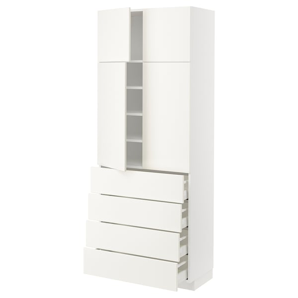 A white METOD kitchen cabinet with multiple drawers and shelves. Modern, clean-line design.