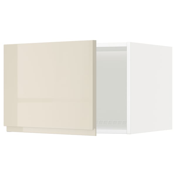 A beige high-gloss METOD kitchen cabinet with a white interior.