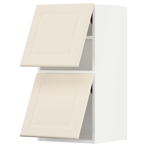 Two beige METOD kitchen cabinets with white interiors.