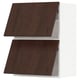 Two tall, white kitchen cabinets with dark brown wooden doors featuring a sleek, minimalist design.