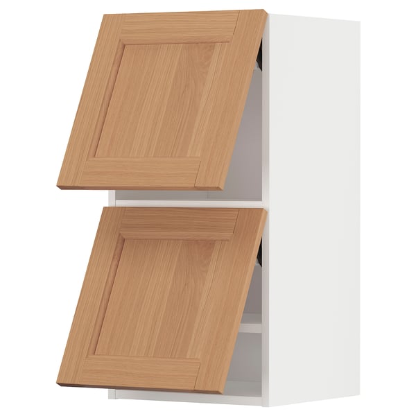 Two light brown wooden kitchen cabinets with flat panel doors, vertically stacked, part of the ikea METOD series.